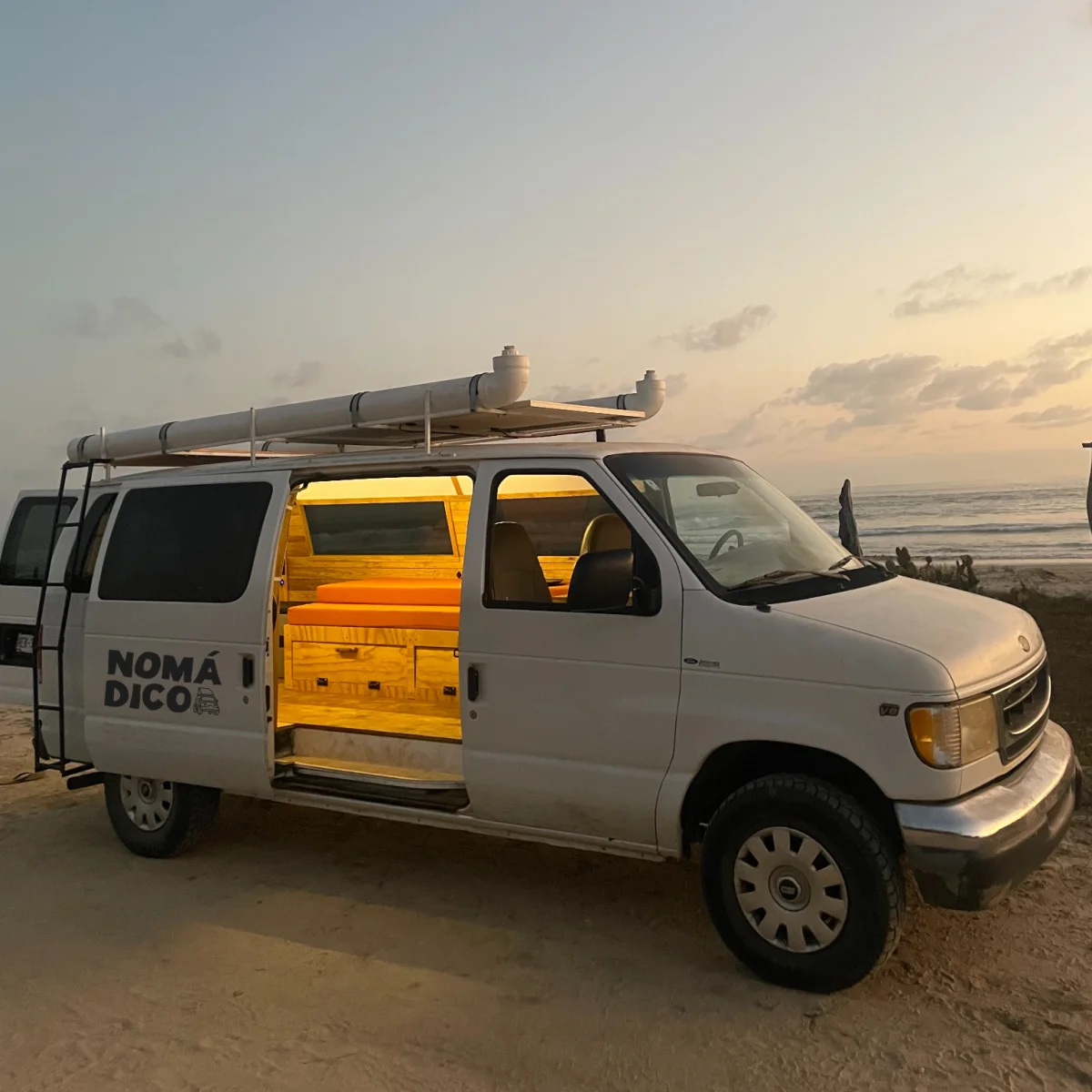Campervan parked on the beach