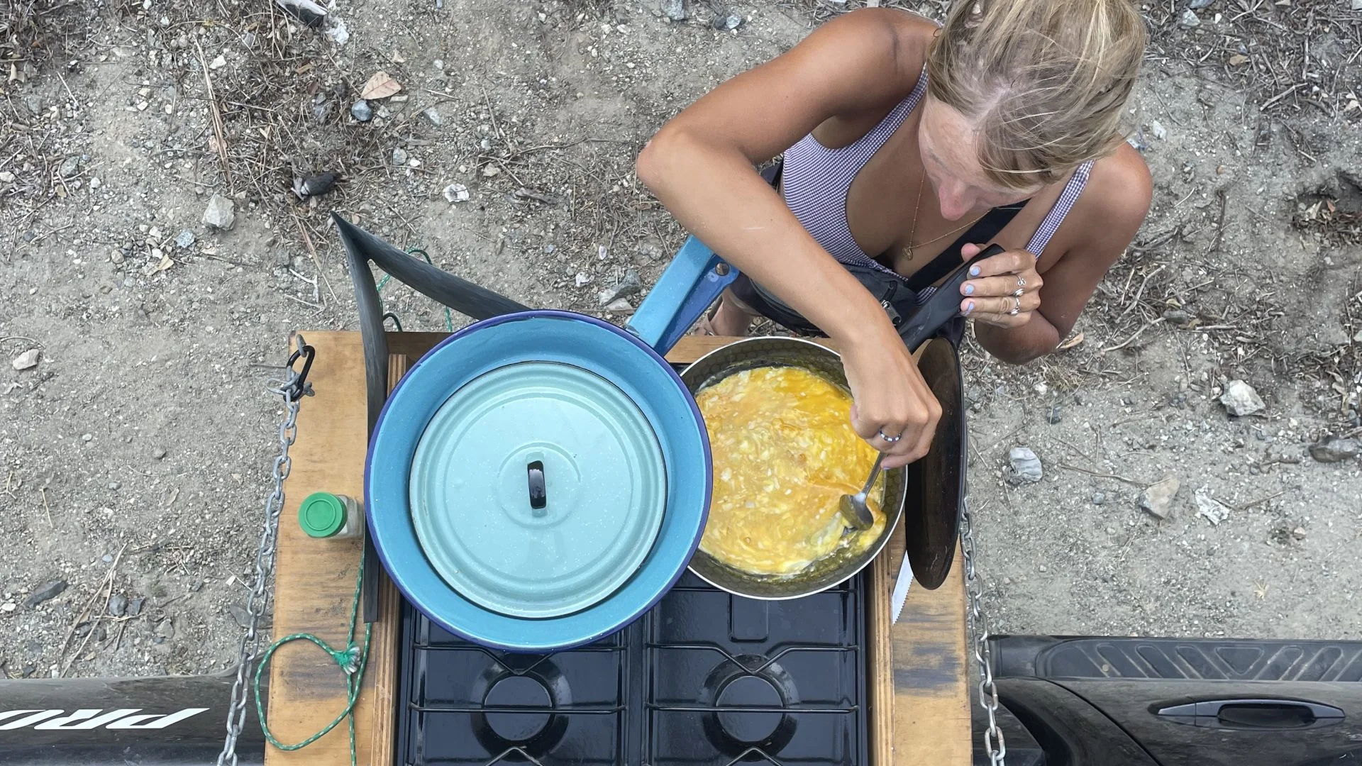people cooking in a campervan