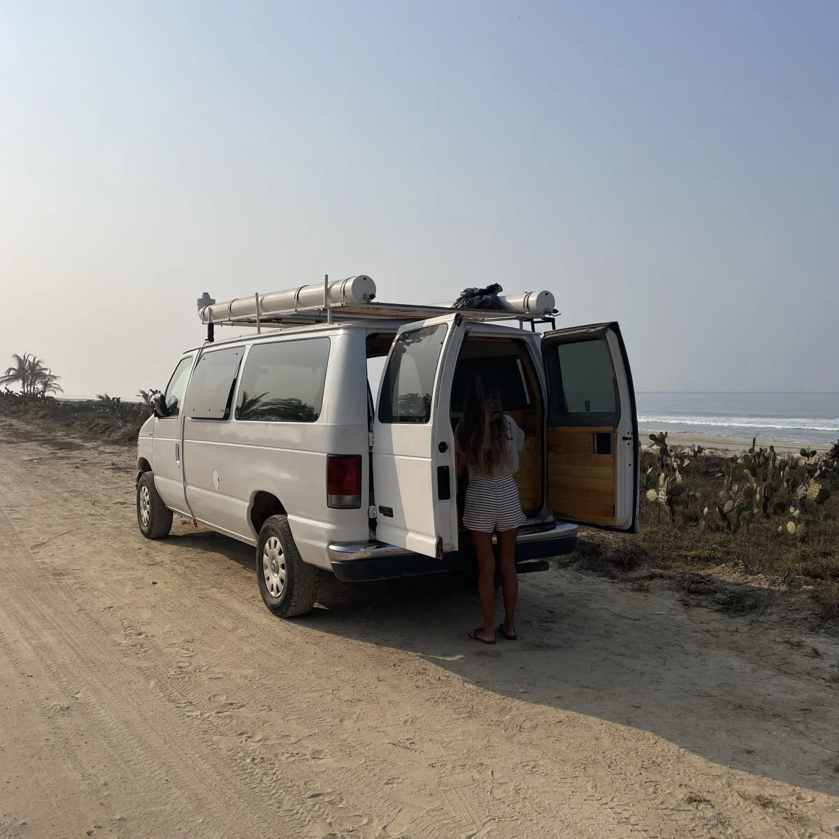Van converted parked on the beach
